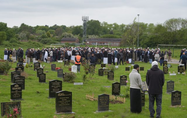 People at the grave of Evha Jannath after her funeral at Saffron Hill Cemetery in Leicester (Ben Birchall/PA)