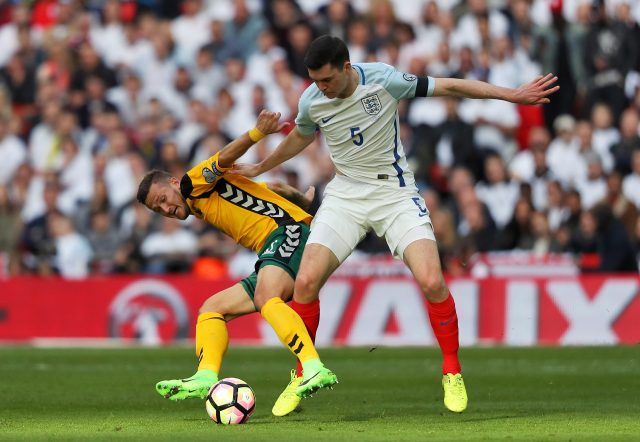 Lithuania's Nerijus Valskis (left) and England's Michael Keane battle for the ball