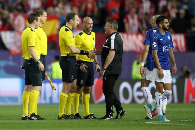 Craig Shakespeare shakes hands with match referee Jonas Eriksson
