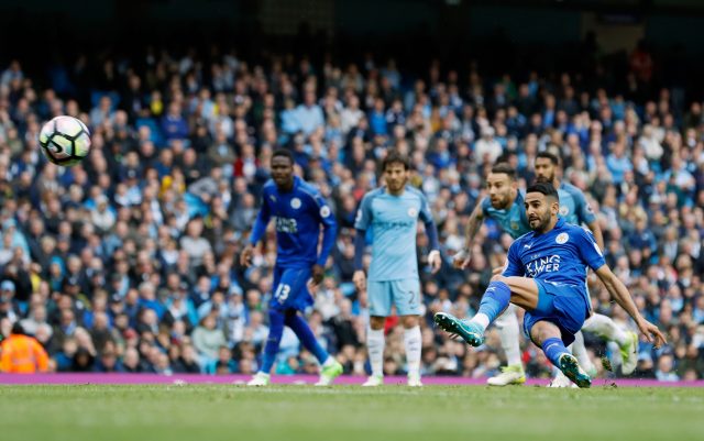 Riyad Mahrez slips over while taking a penalty