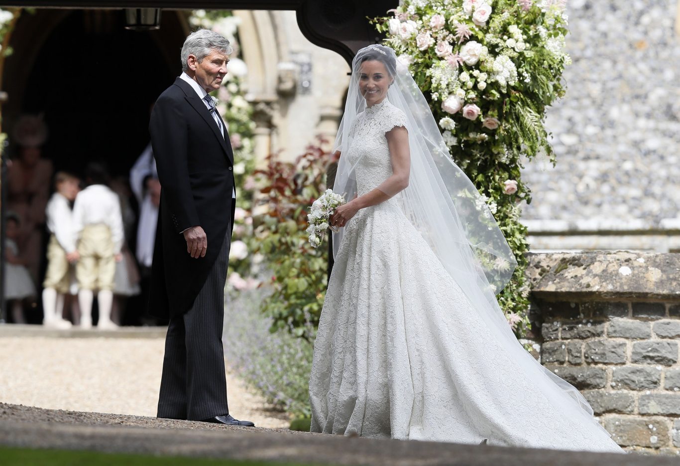 The Duchess of Cambridge's sister Pippa Middleton arrives with their father Michael Middleton (Kirsty Wigglesworth/PA)