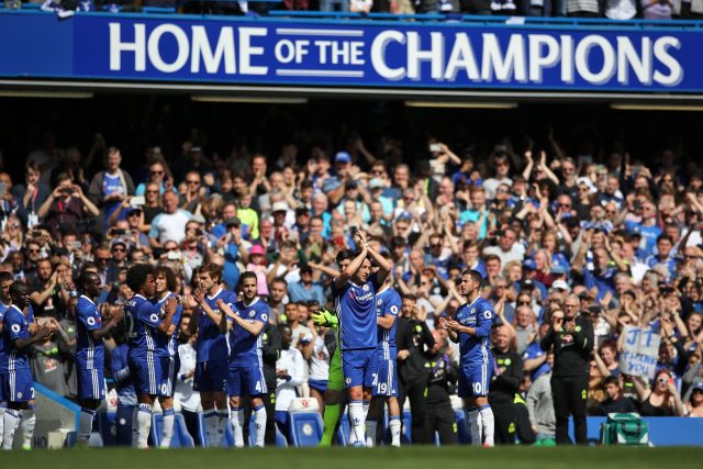 John Terry applauds the Chelsea fans as he leaves the pitch