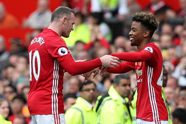 Manchester United's Angel Gomes (right) is substituted on for Wayne Rooney (left) (Martin Rickett/PA)