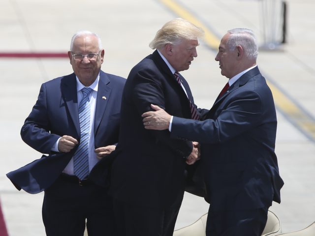 US President Donald Trump shakes hands with Israeli Prime Minister Benjamin Netanyahuwith accompanied by President Rueven Rivlin (Oded Balilty/AP)
