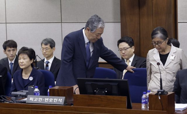 Choi Soon-sil arrives for her trial. (Ahn Young-joon/AP)