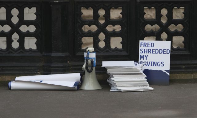 Placards outside the Rolls Building in central London (Steve Parsons/PA)