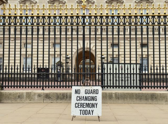 A sign outside Buckingham Palace, London, after the Changing the Guard ceremony at the palace was cancelled (Dominic Lipinski/PA)