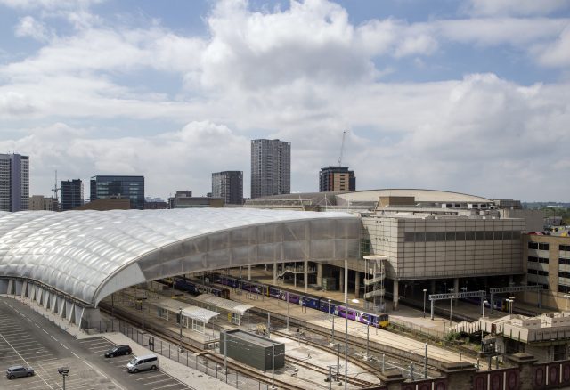 Manchester Arena (right) and Victoria railway station 