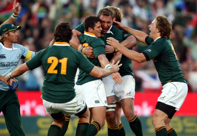 South Africa's Morne Steyn is mobbed by his team-mates after kicking the winning penalty