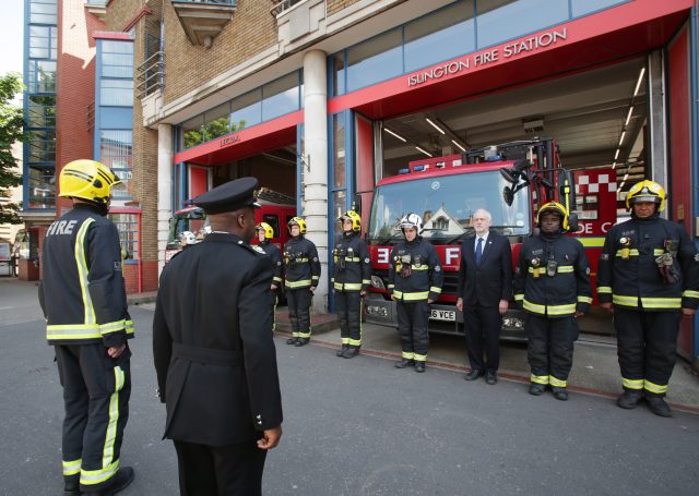 Labour leader Jeremy Corbyn (third right back) joins fire fighters at Islington Fire Station, north London (Yui Mok/PA)