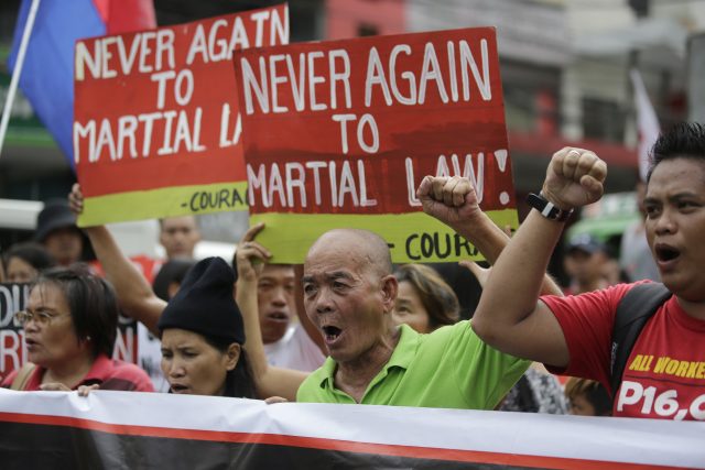 Activists shout slogans as they oppose the declaration of martial law
