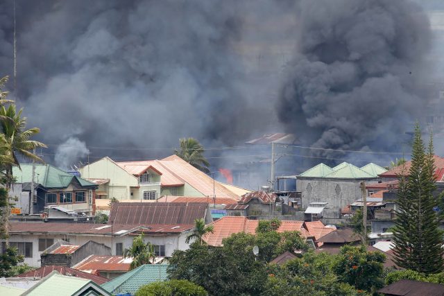 Smoke rises following airstrikes by Philippine Air Force to retake control of Marawi city, southern Philippines (Bullit Marquez/AP)