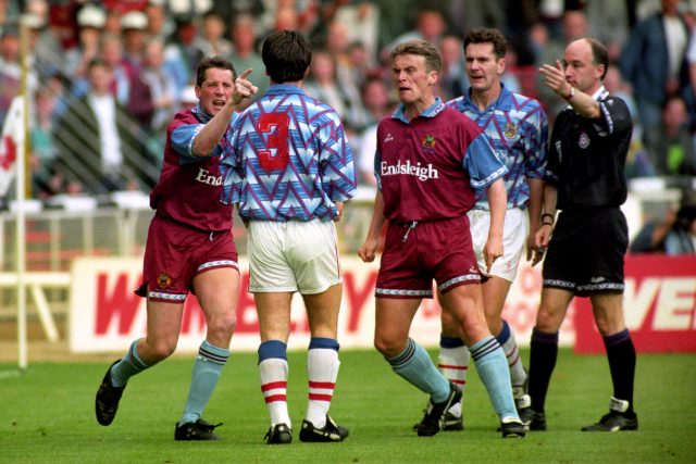 Burnley's Ted McMinn points an a accusing finger at Michael Wallace before the Stockport player was sent off (Harris/PA)