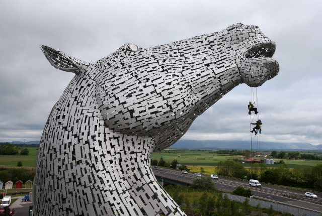 Rope Access Technicians Andrew Pennycuick (bottom), Paul Smith (centre) and John Benson carry out the first health check on the Kelpies in Falkirk as they approach their third birthday)