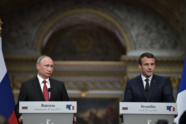 French President Emmanuel Macron (right) and his Russian counterpart Vladimir Putin hold a joint press conference at the Palace of Versailles (Alexei Nikolsky/AP/PA)