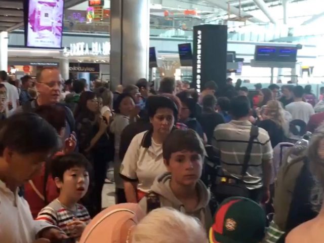 Passengers queuing at Heathrow Airport Terminal 5 (Emily Wilson/PA)