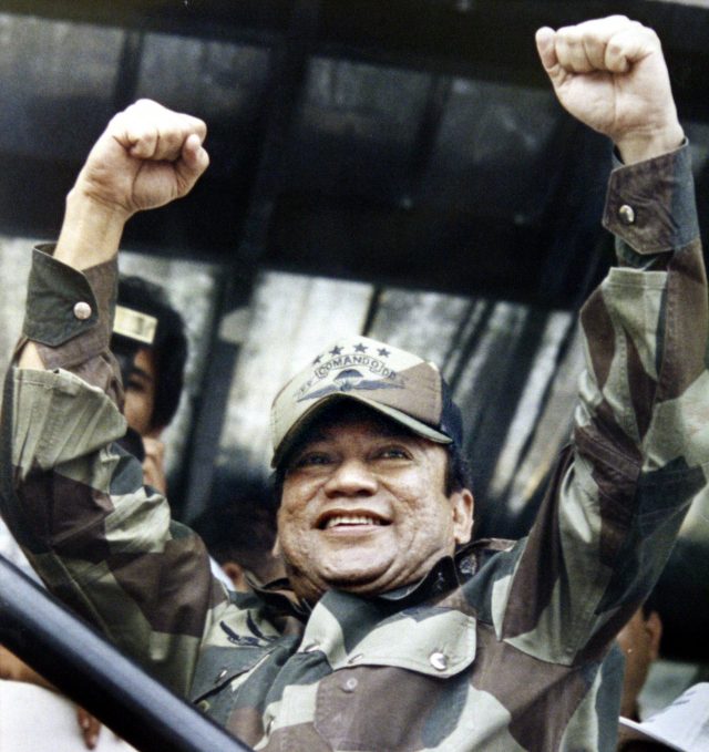 Manuel Noriega raises his fists to acknowledge the crowd cheers during a Dignity Battalion rally in Panama City 