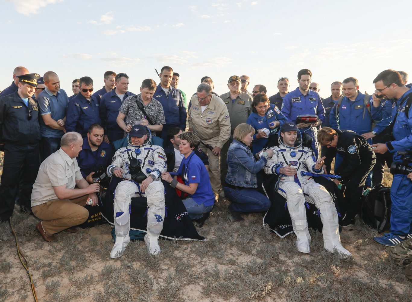 Russian cosmonaut Oleg Novitsky (left) and French astronaut Thomas Pesquet rest after landing (Shamil Zhumatov/AP)