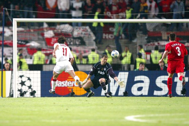 AC Milan striker Hernan Crespo lifts the ball over Liverpool goalkeeper Jerzy Dudek