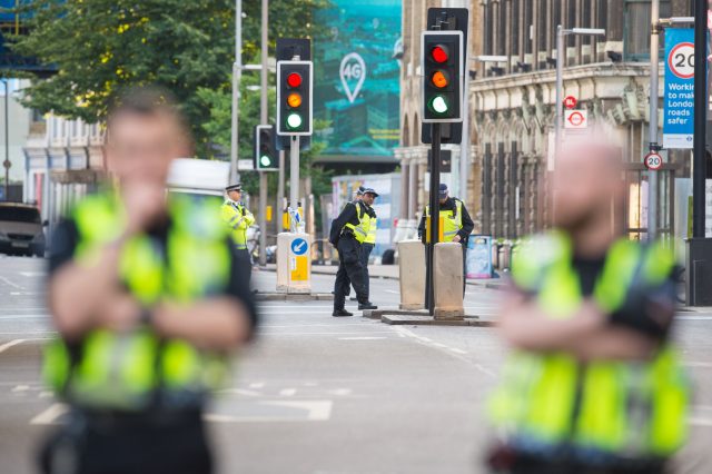 Police at the scene in London Bridge and Borough Market as the day breaks (Dominic Lipinski/PA)