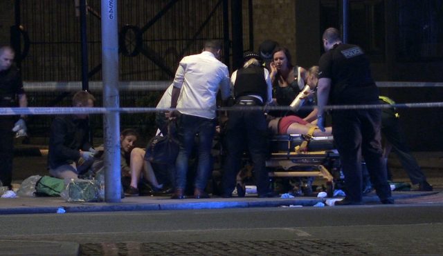 Screengrab taken from video footage of some of the wounded being treated by ambulance staff (PA)