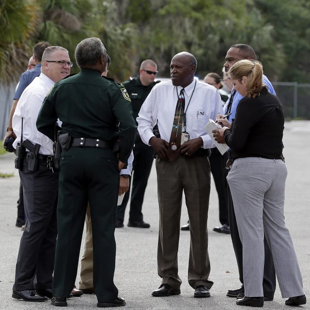 Police investigate at an industrial area near Orlando (John Raoux/AP)