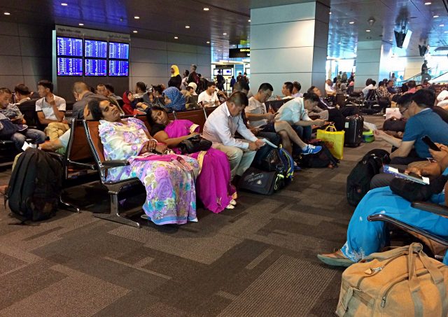Stranded passengers at Hamad International Airport in Doha (Hadi Mizban/AP)