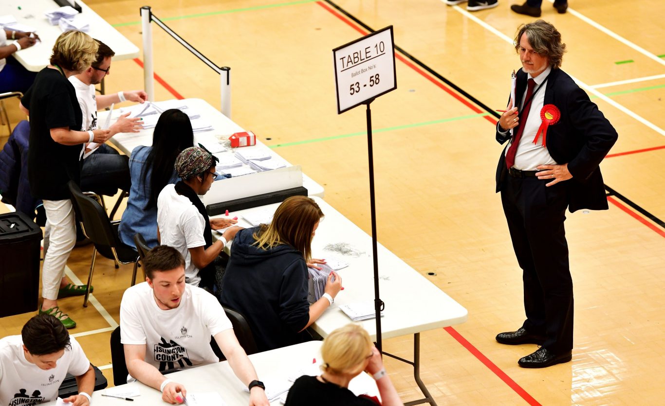 Election staff count ballot papers in Islington, north London (Dominic Lipinski/PA)