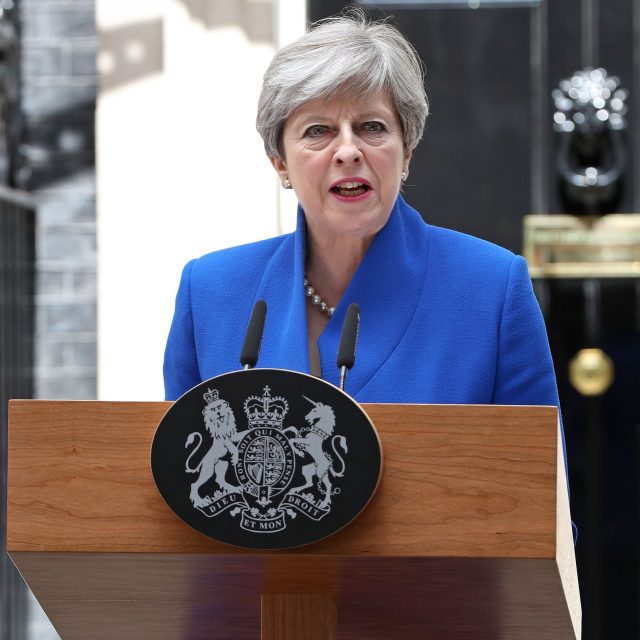 Theresa May speaks in Downing Street after meeting the Queen (Jonathan Brady/PA)