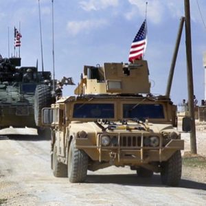 Syrian forces patrolling on the outskirts of the Syrian town of Manbij, in Aleppo province