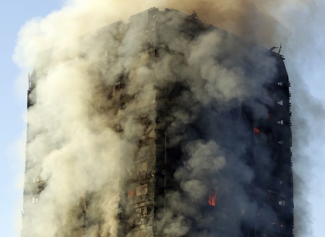 Smoke rises from a building on fire in London (Matt Dunham/AP)