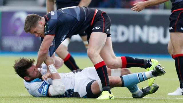 Ryan Wilson clashes with Saracens' Owen Farrell while playing for Glasgow