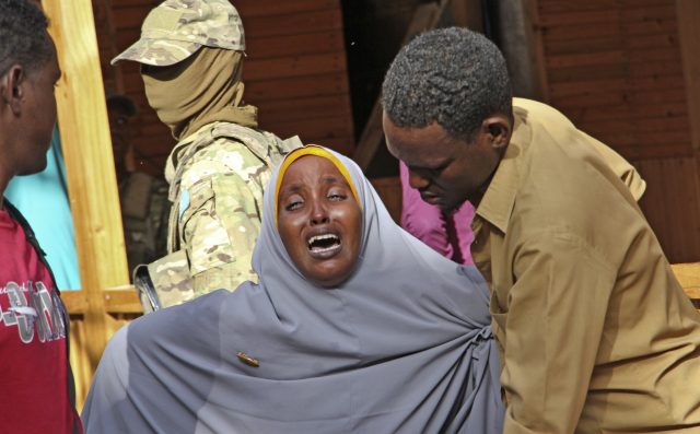 A mother whose daughter was shot grieves in Mogadishu. (Farah Abdi Warsameh/AP)