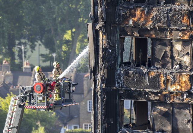 Water is sprayed on Grenfell Tower by fire crews (Rick Findler/PA)