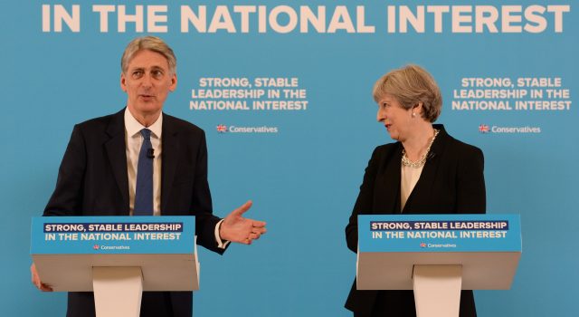 Theresa May and  Philip Hammond during a general election campaign event (Stefan Rousseau/PA)