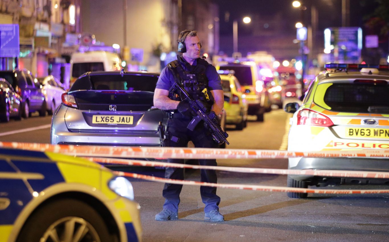 An armed police officer on the cordon (Yui Mok/PA)