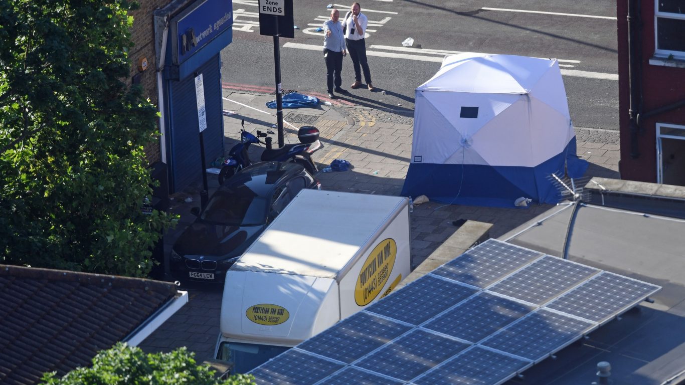 A forensic tent stands next to a van in Finsbury Park (Victoria Jones/PA)