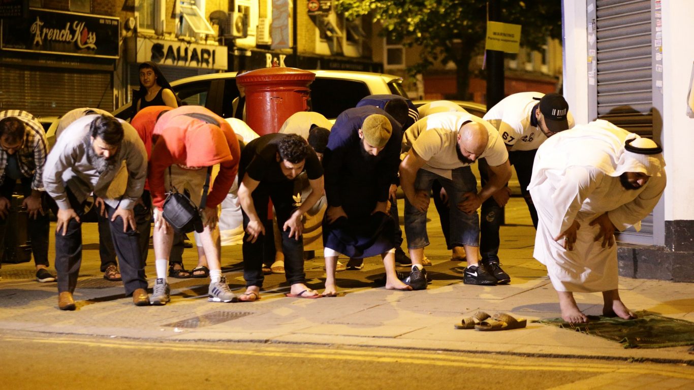 Local people observe prayers at Finsbury Park (Yui Mok/PA)