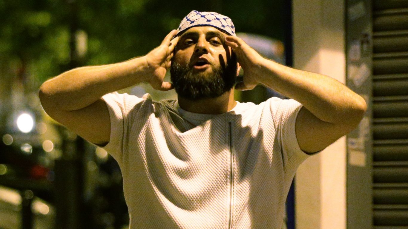 A man observes prayers at Finsbury Park (Yui Mok/PA)