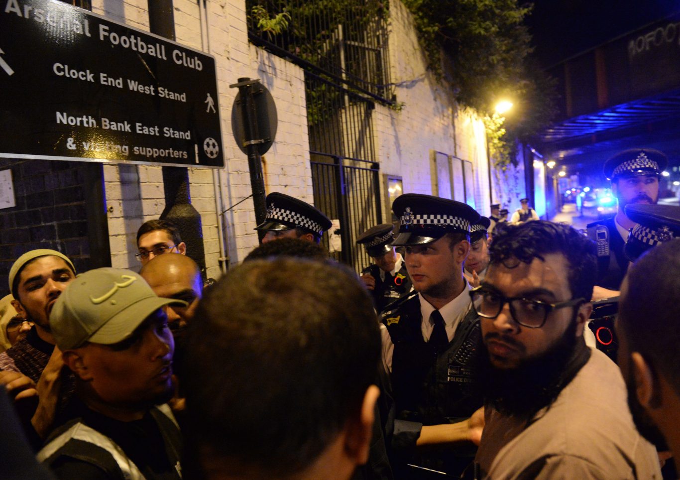 Police officers talk with local people at Finsbury Park (Yui Mok/PA)