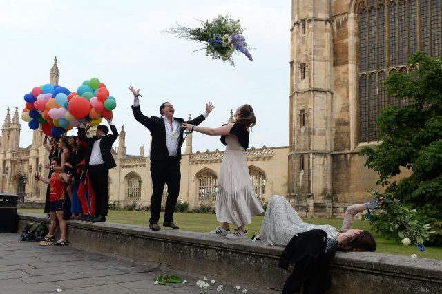 Students from Cambridge University make their way home after celebrating the end of the academic year at the May Ball
