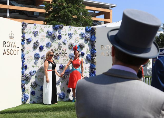 Racegoers pose for a photo during day one of Royal Ascot