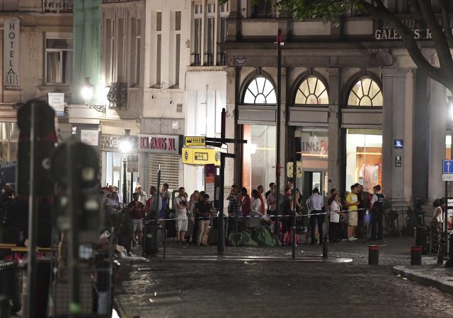 People gather at the Grand Place square near Central Station in Brussels after a reported explosion