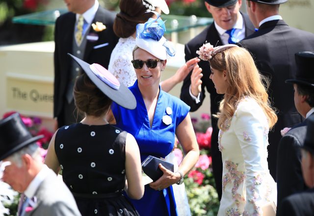 Zara Tindall (centre) greets Princess Eugenie of York (left) and Princess Beatrice of York