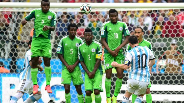 Lionel Messi scores against Nigeria in the 2014 World Cup
