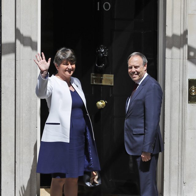 DUP leader Arlene Foster and deputy leader Nigel Dodds arrive at Downing Street for talks with Theresa May (Frank Augstein/AP)