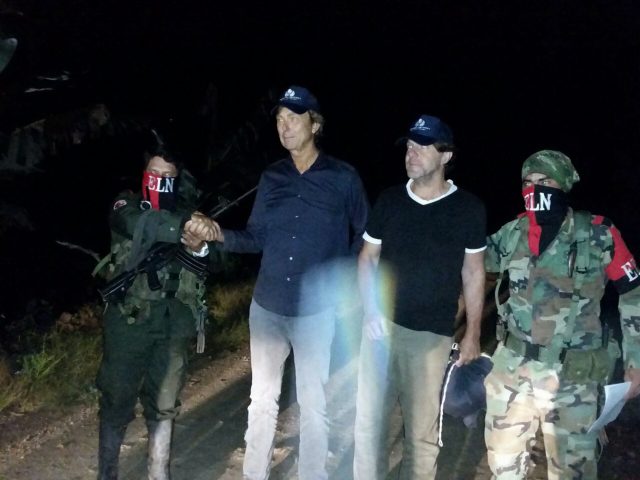 Rebels of Colombia's National Liberation Army, ELN, release Dutch journalists Derk Bolt, second from left, and Eugenio Follender, second from right (Colombia's Ombudsman Press Office via AP)