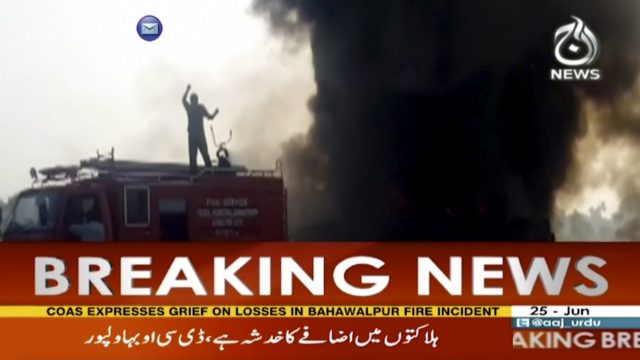 In this image taken from video, black smoke rises from oil tanker on road in Bahawalpur, Pakistan (AAJ <a href=