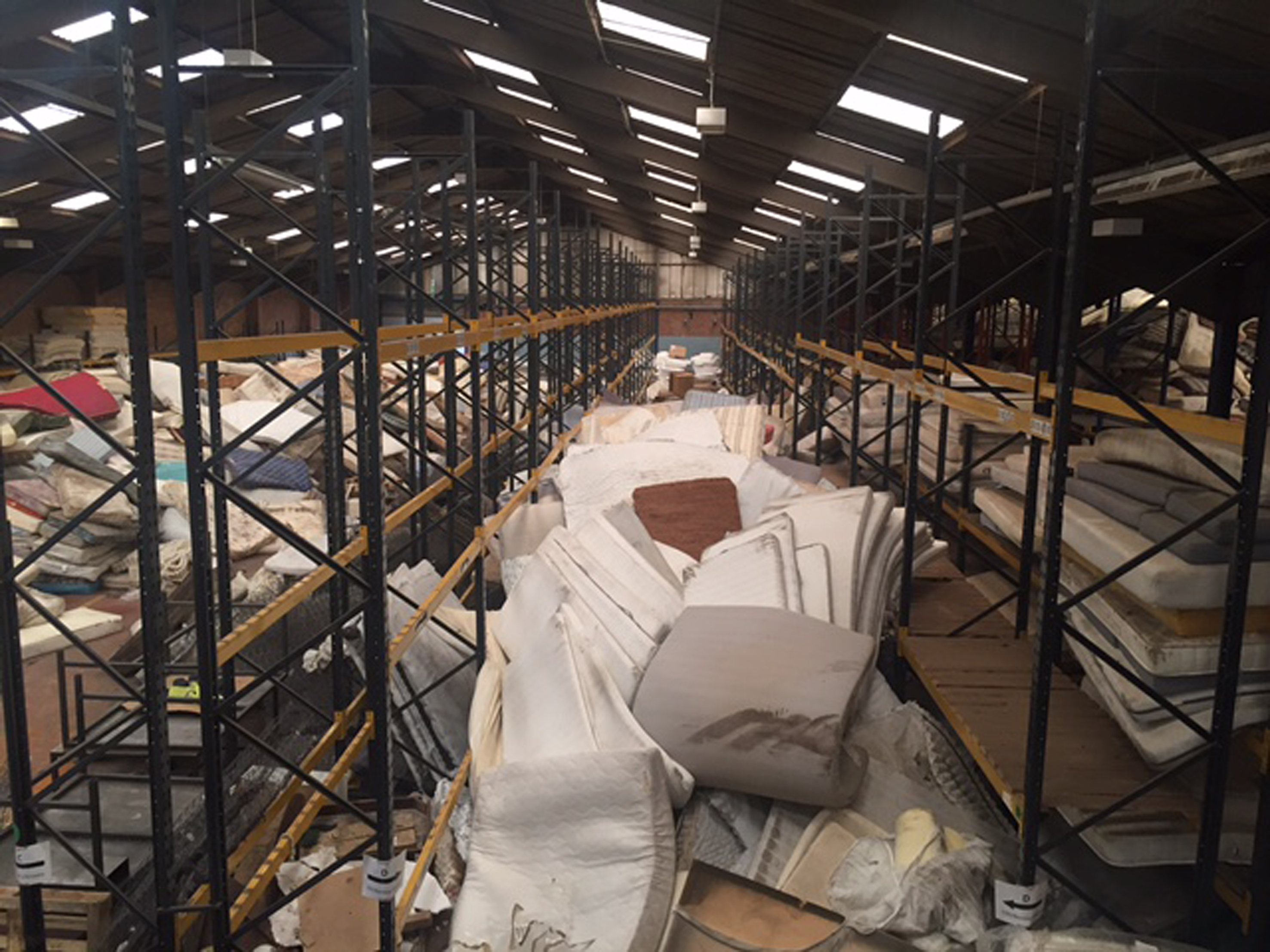 Discarded mattresses at a recycling centre.