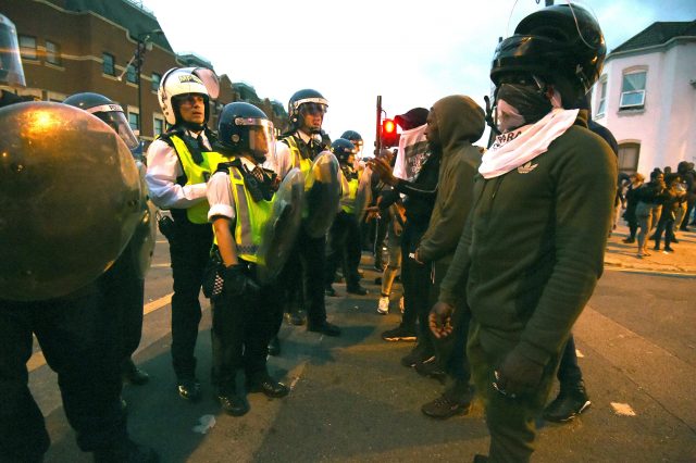 Campaigners face off with police near Richmond Road in Forest Gate, north east London (Lauren Hurley/PA)